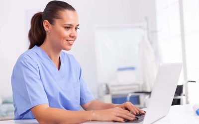Nurse typing on computer